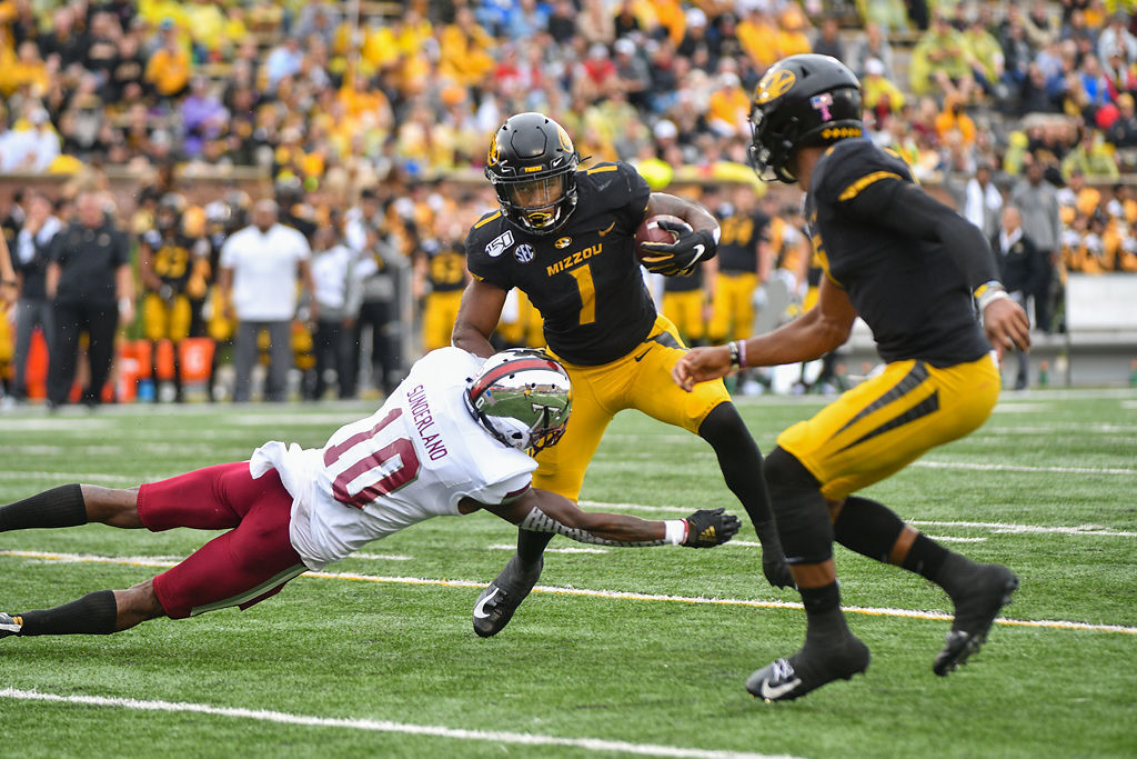 Missouri RB Tyler Badie leaps to evade the tackle
